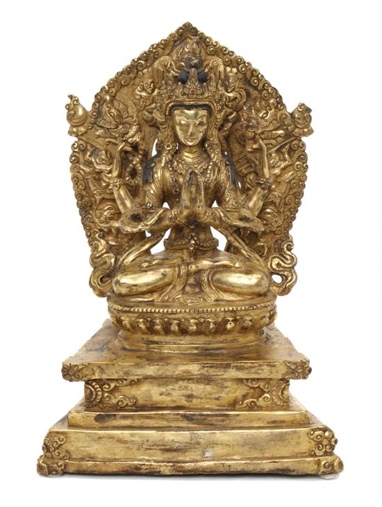 A Gilt Bronze Model of a Deity