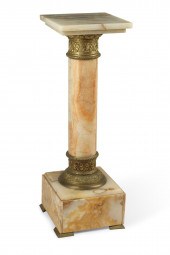A GILT BRONZE MOUNTED ONYX PED