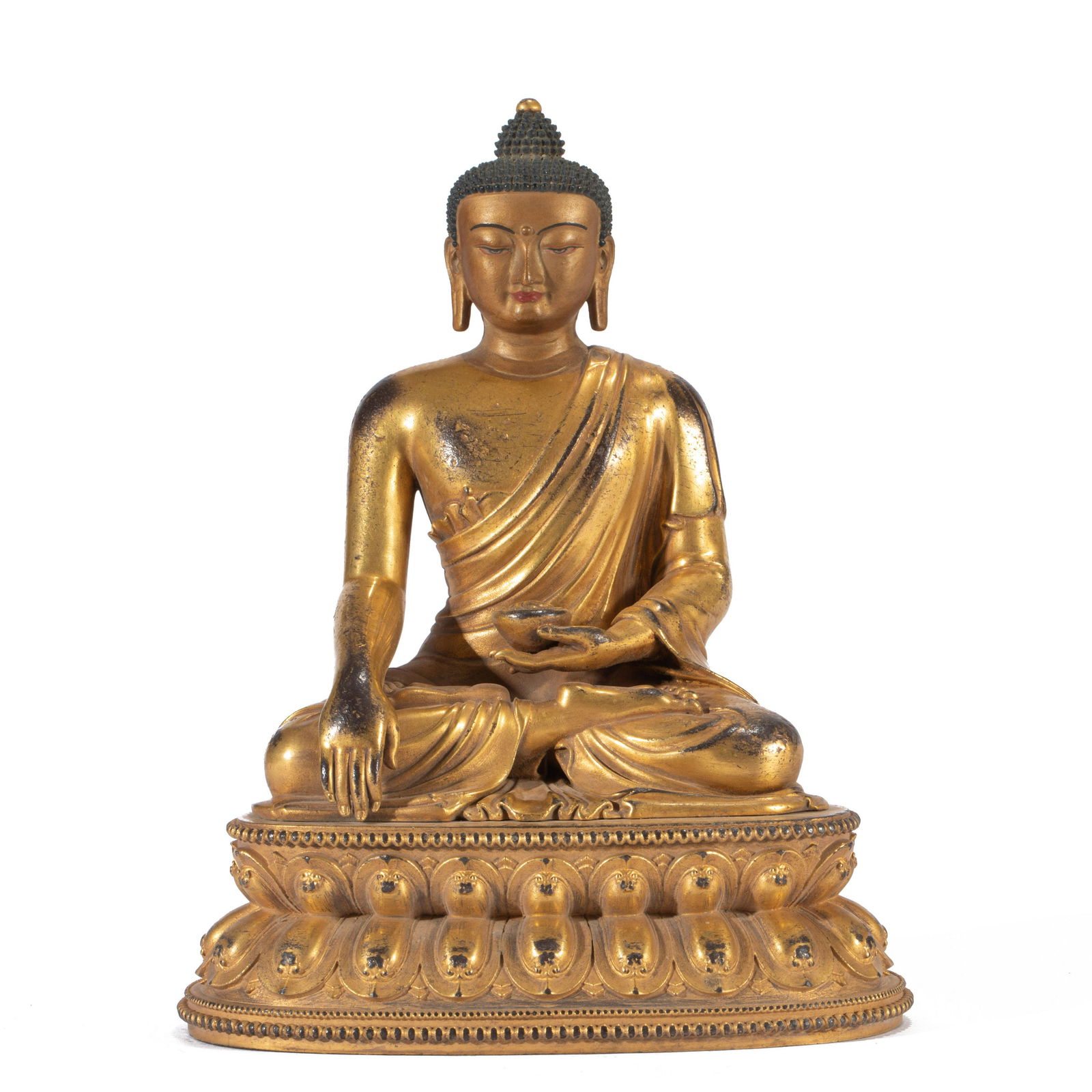 A GILT BRONZE SEATED FIGURE OF