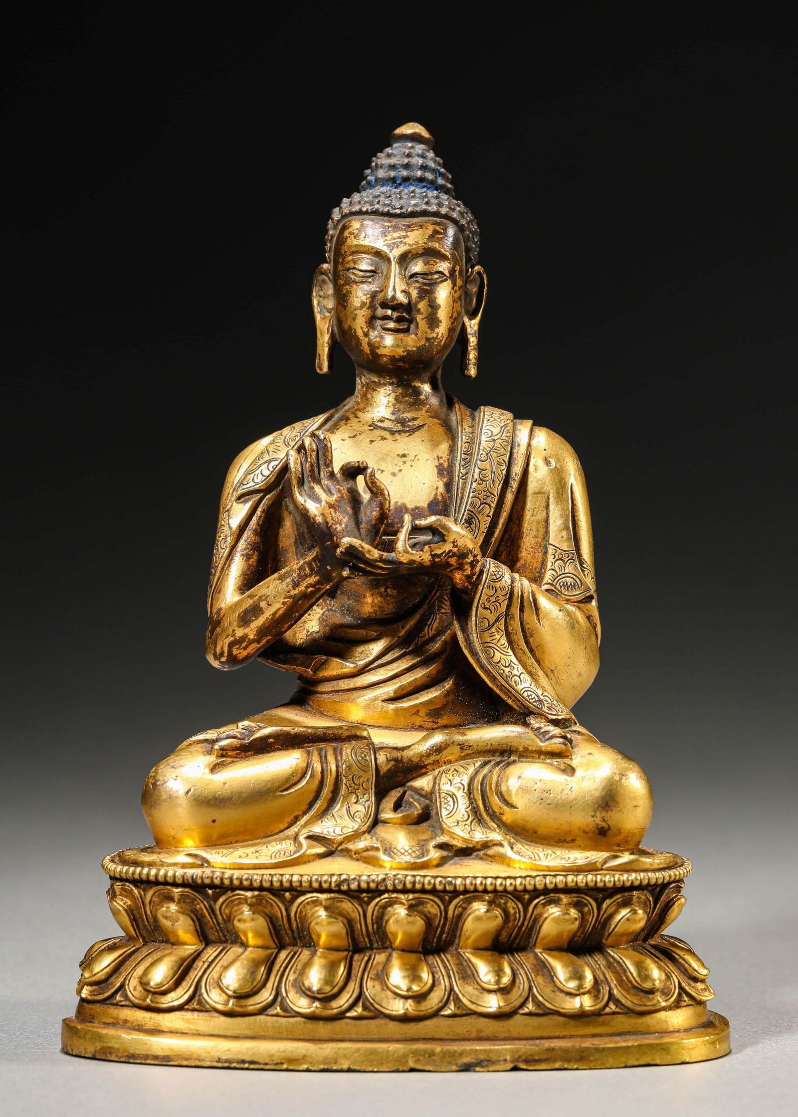 A GILT-BRONZE SHAKYAMUNI BUDDHA