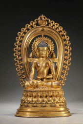 A GILT-BRONZE SHAKYAMUNI FIGUR