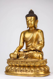 A GILT-BRONZE SHAKYAMUNI<br>A