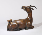 A GILT-BRONZE SILVER-INLAID 'S