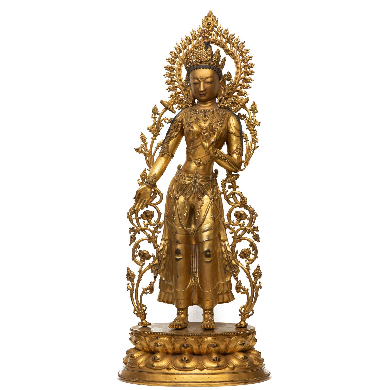 A GILT BRONZE STANDING FIGURE OF