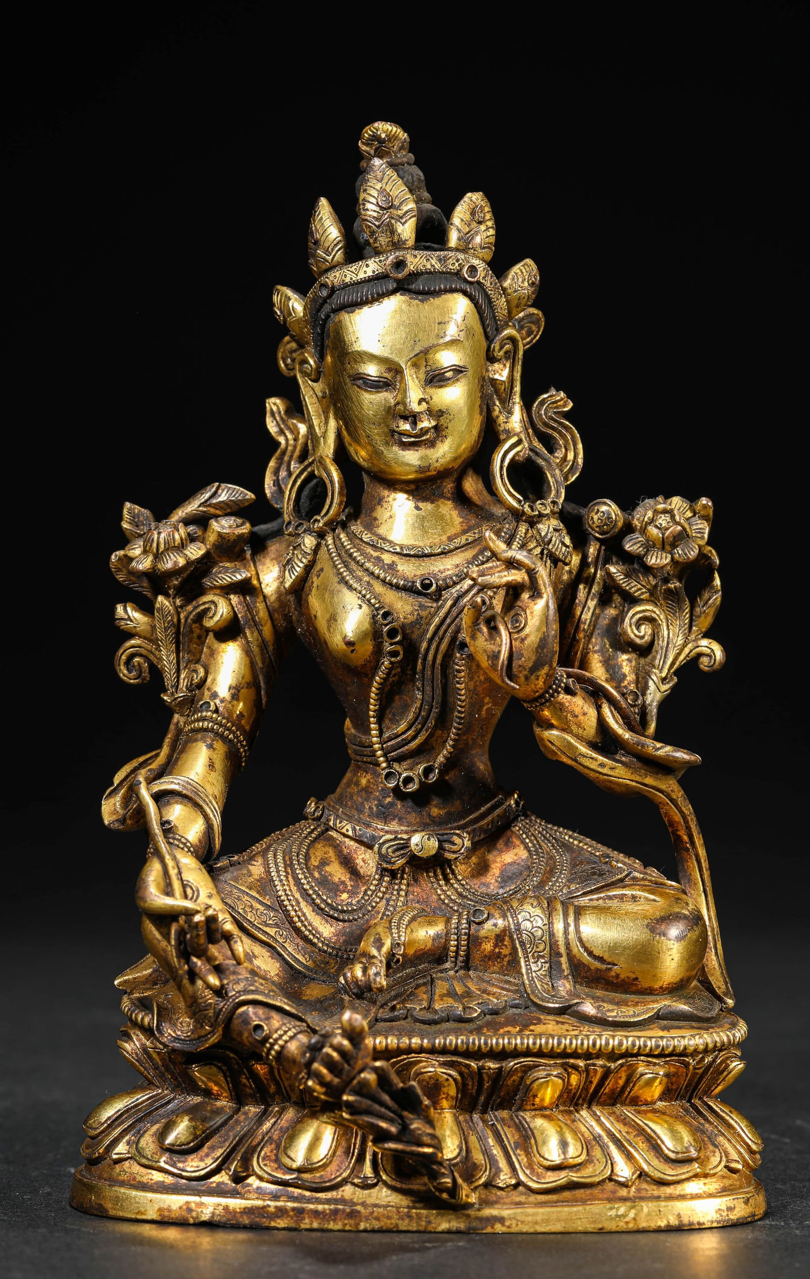 A GILT-BRONZE TARA FIGUREA