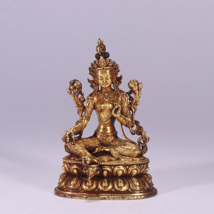 A GILT BRONZE TARA STATUEA GILT