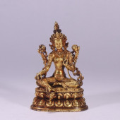 A GILT BRONZE TARA STATUE<br>A