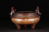 A GILT BRONZE TRIPOD DOUBLE DR