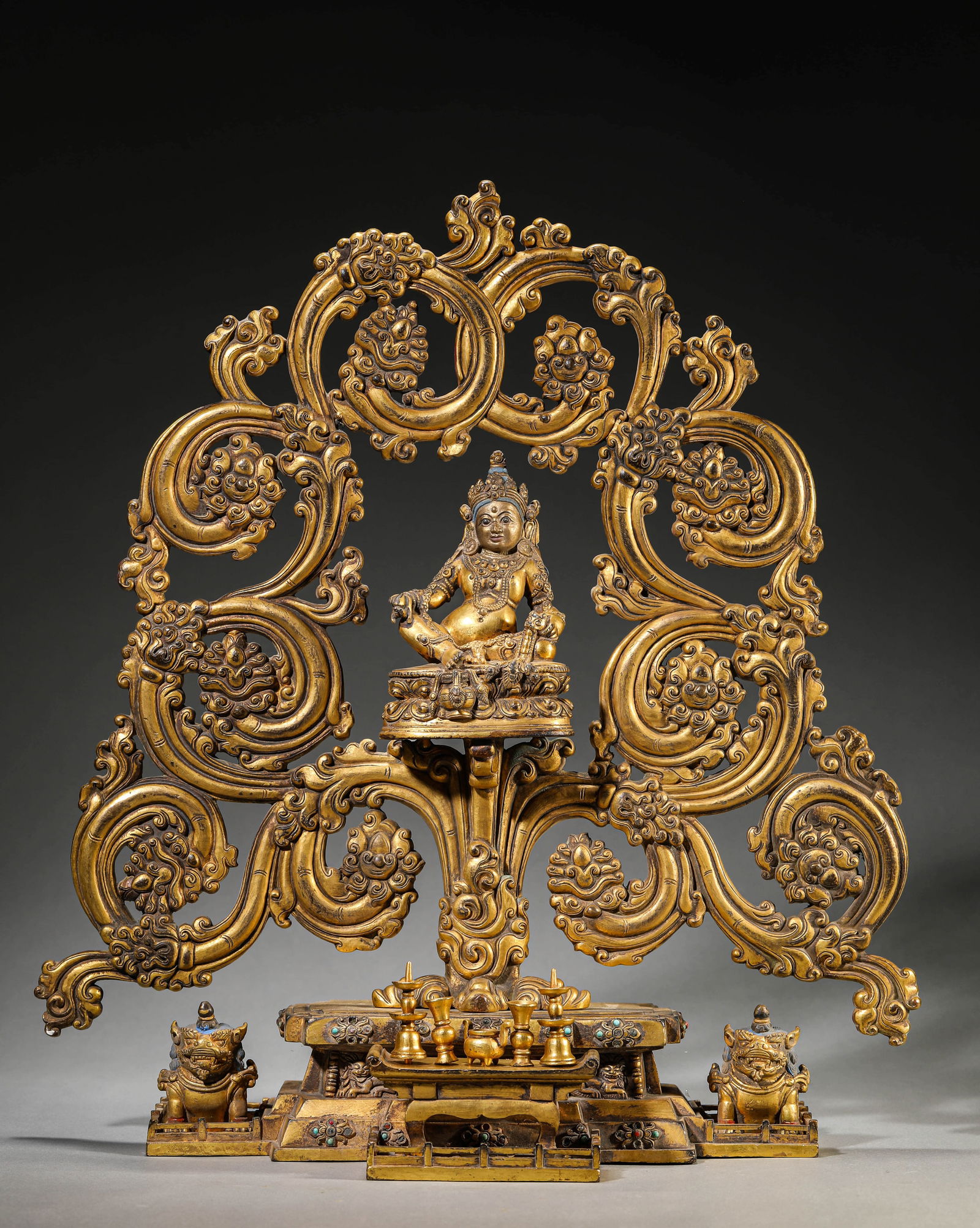 A GILT-BRONZE YELLOW GOD OF