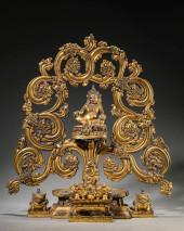 A GILT-BRONZE YELLOW GOD OF WE
