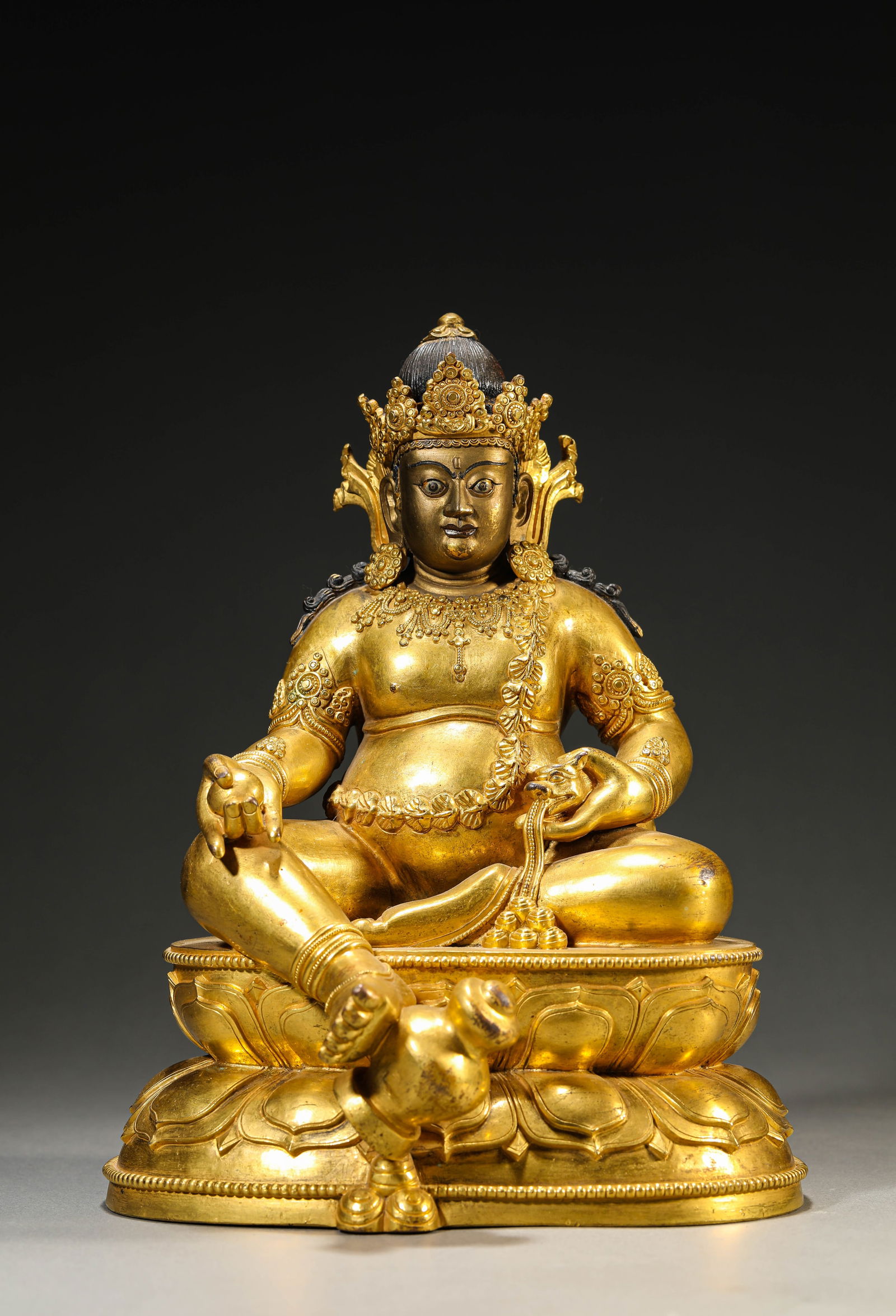 A GILT-BRONZE YELLOW GOD OF WEALTHA