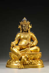 A GILT-BRONZE YELLOW GOD OF WE