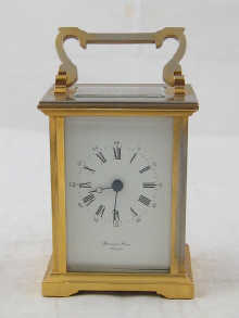 A gilt cased carriage clock with