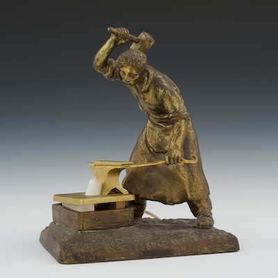 A Gilt Cast Metal Blacksmith