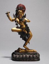 A GILT-COPPER ALLOY FIGURE OF
