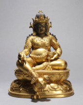 A GILT-COPPER ALLOY FIGURE OF