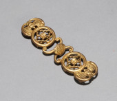 A GILT-COPPER BELTHOOK<br>A GI