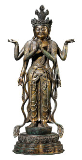 A GILT-COPPER SIX-ARMED GUANYI