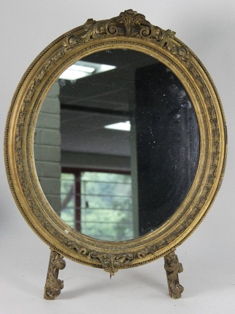 A gilt gesso framed easel type