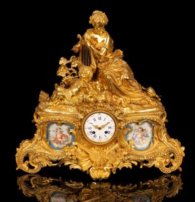 A gilt metal and porcelain