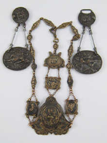 A gilt metal chatelaine with