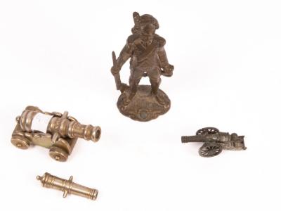 A gilt metal figure of a soldier,