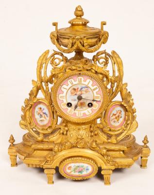A gilt metal mounted mantel