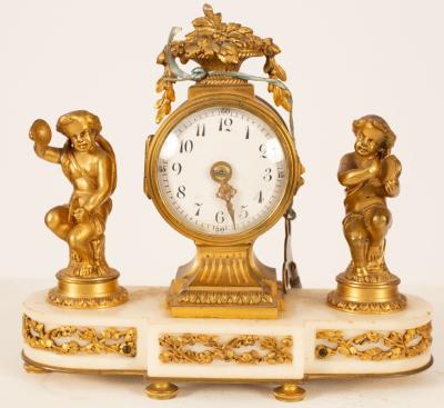 A gilt metal mounted mantel