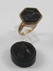 A gilt metal ring set with