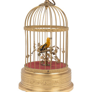 A Gilt Metal Singing Bird in Cage