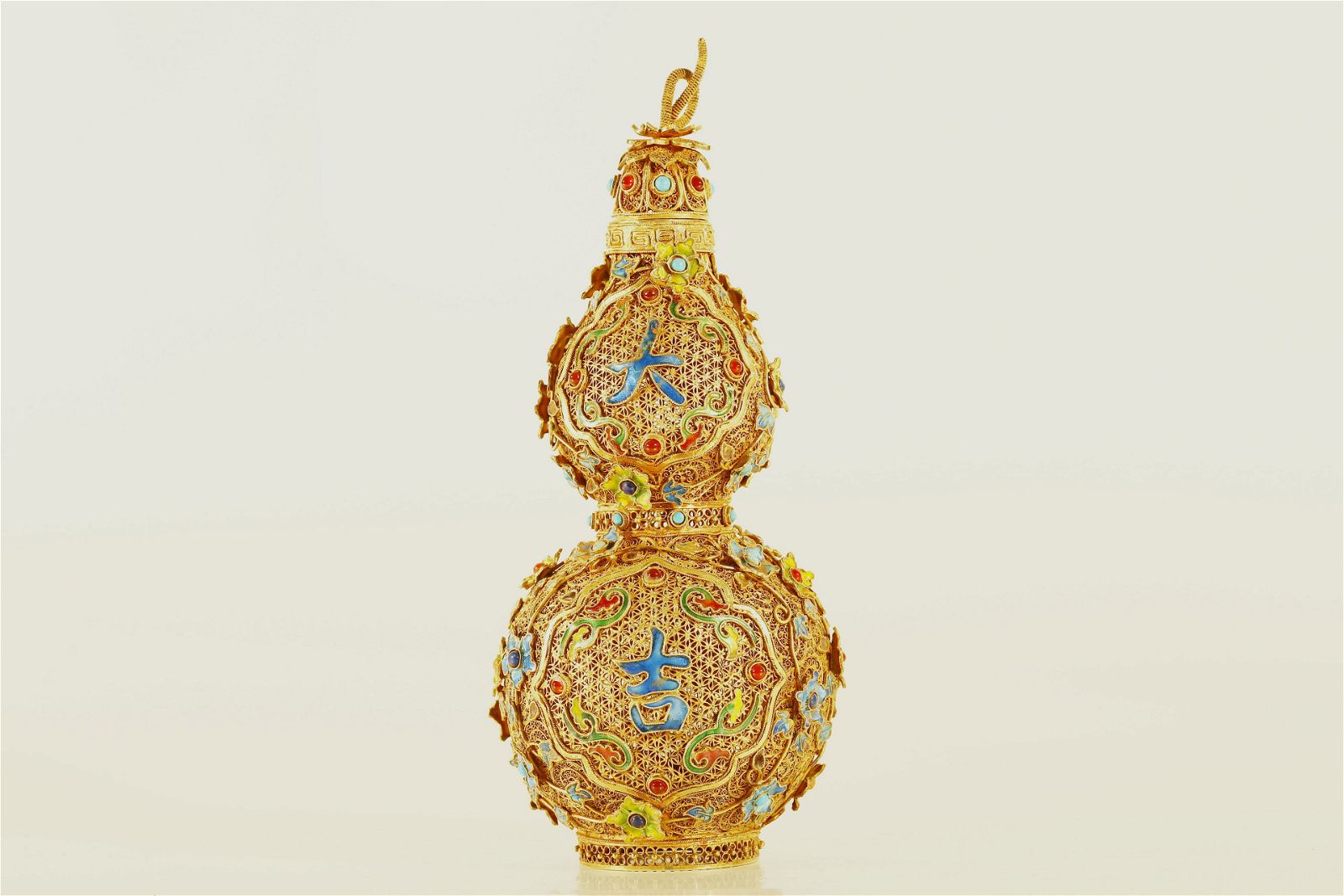 A GILT-SILVER DOUBLE-GOURD VASEA