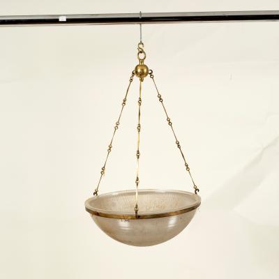 A glass ceiling shade suspended