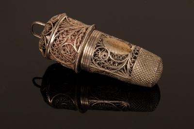 A glass scent bottle in a