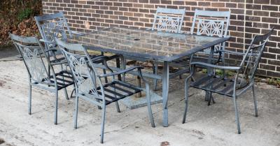 A glass topped garden table,