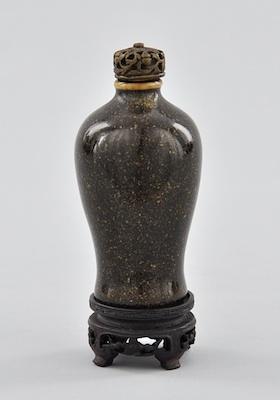 A Glazed Ceramic Snuff Bottle and
