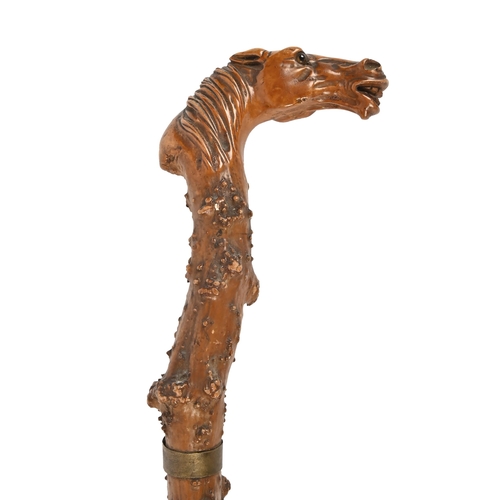 A gnarled wood cane, c1900, the