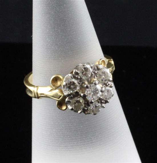 A gold and diamond cluster ring