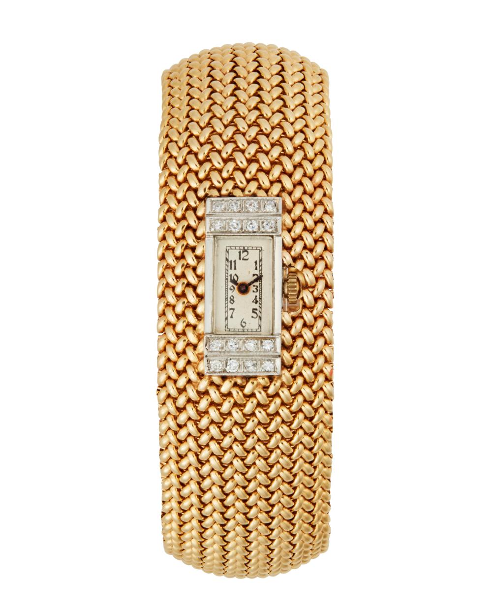 A GOLD AND DIAMOND WATCH