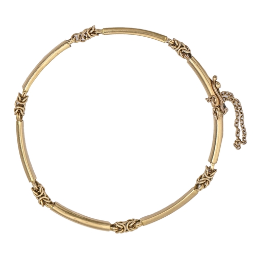 A gold bracelet, of seven curved
