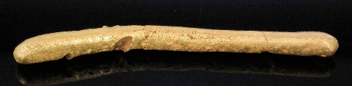 A gold coloured metal branch