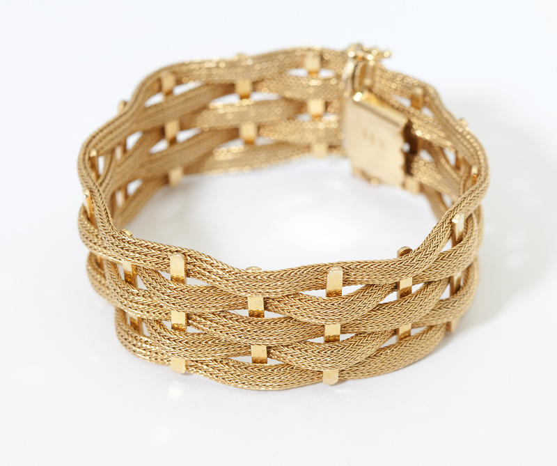 A gold five-row woven bracelet