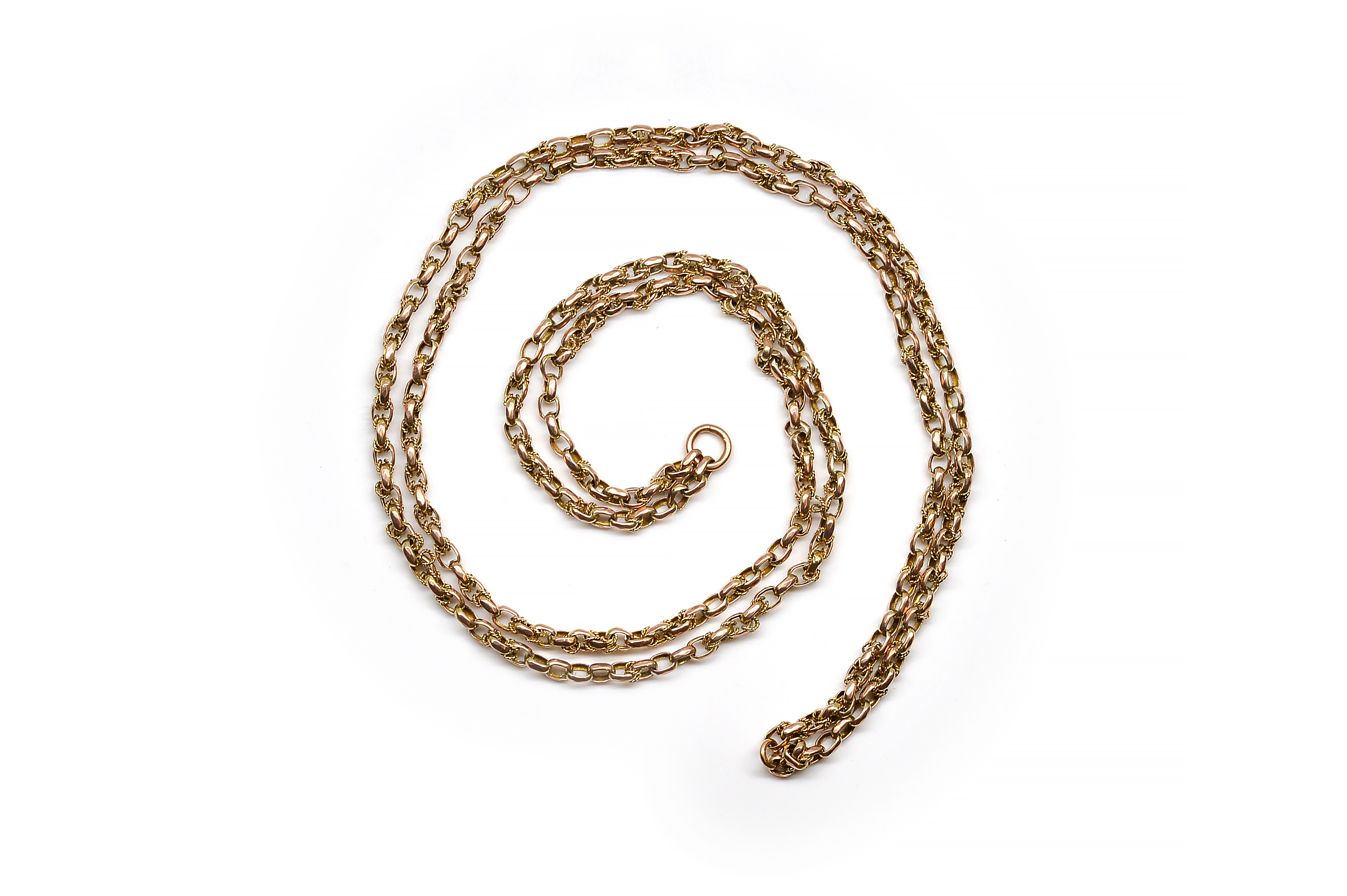 A GOLD LONG CHAIN In an oval and