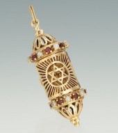 A Gold Mezuzah Pendant With Ga