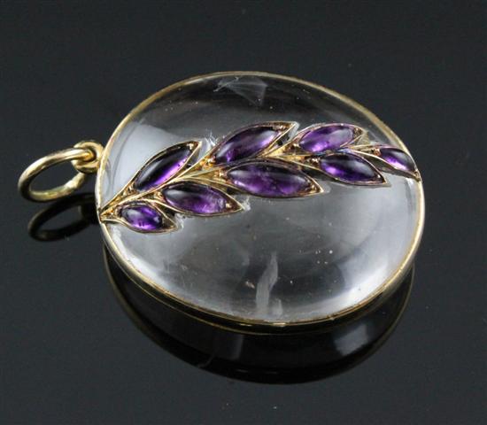A gold mounted glass locket