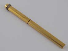 A gold plated ball point pen with