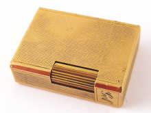 A gold plated cigarette lighter