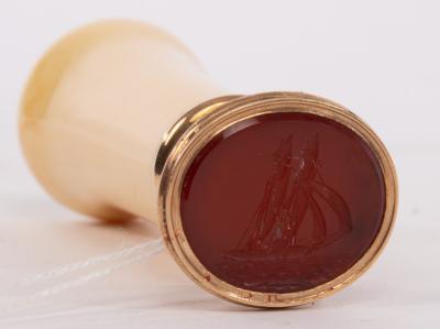 A gold seal, the carnelian set a