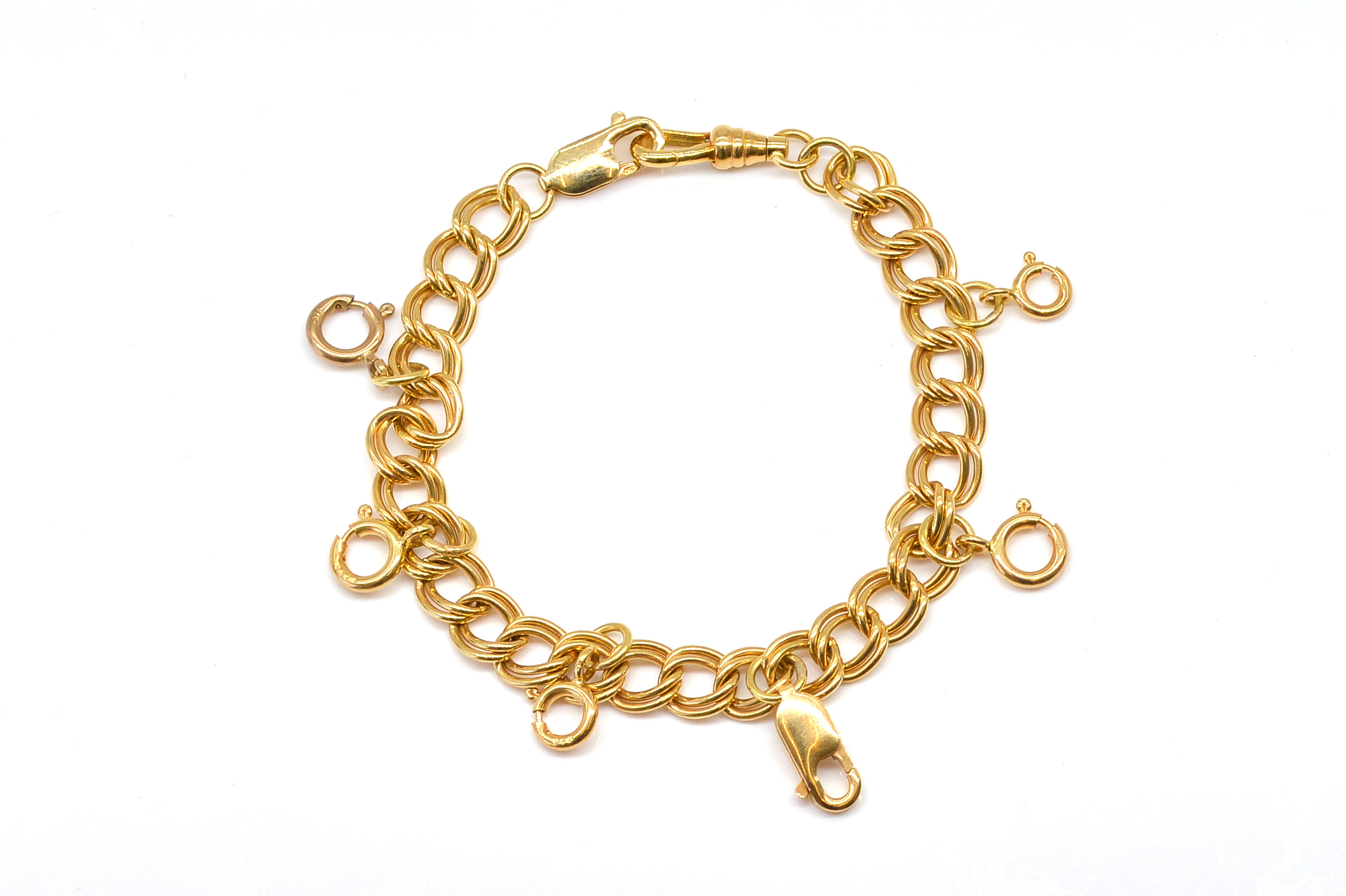 A GOLD TWIN CURB LINK BRACELET WITH