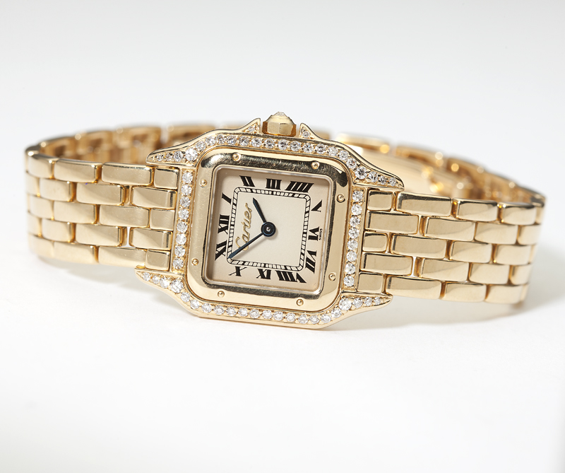 A gold wristwatch Cartier