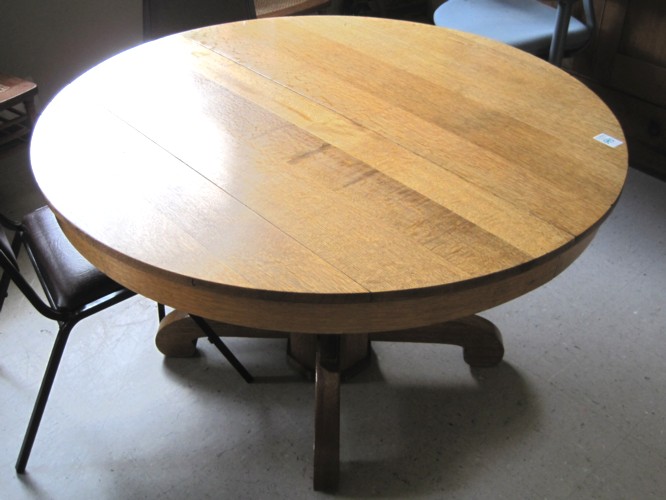 A GOLDEN OAK PEDESTAL DINING